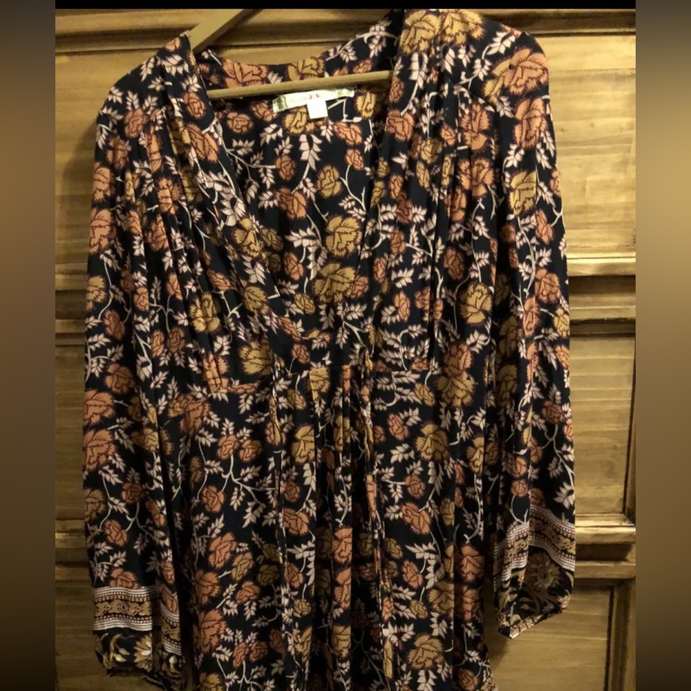 Floral above the knee dress. Hidden zipper on the side, ties. Cute fall dress